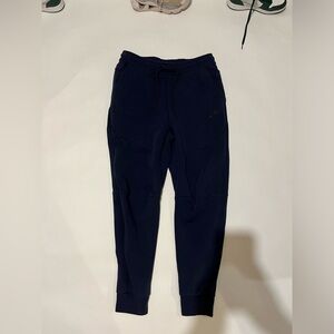 Blue Nike tech pants